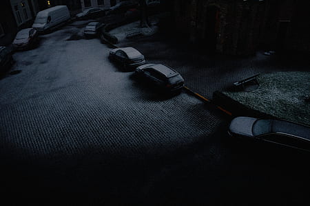 cars parked on roadside during nighttime thumbnail