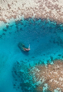 sunk boat on body of water thumbnail
