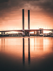 brown concrete bridge at golden hour thumbnail