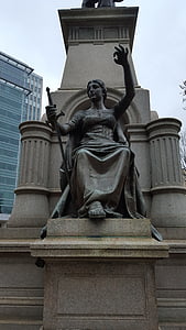 woman holding sword statue thumbnail