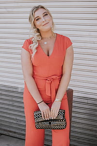 woman standing beside roll-up door thumbnail