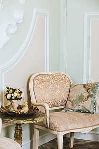 Throw Pillow On Armchair Beside Table thumbnail