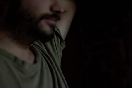man wearing green wearing top thumbnail