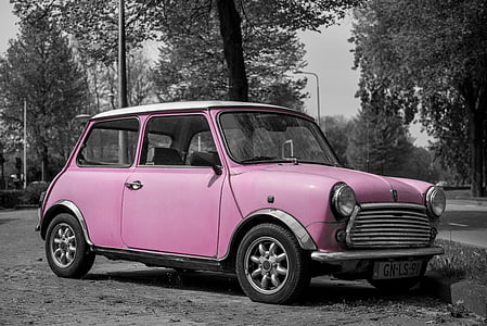 selective color photography of pink 3-door hatchback thumbnail