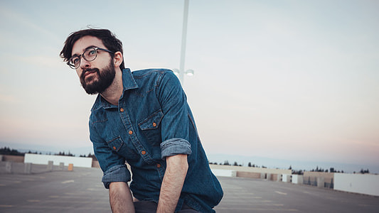 man wearing blue denim dress shirt thumbnail