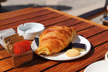 baked bread on plate on table at daytime thumbnail