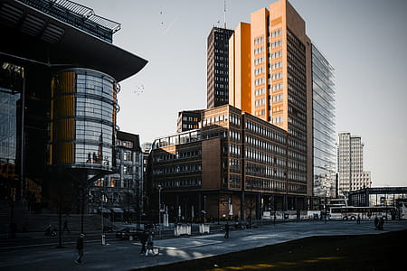 Brown Building Near Orange Painted Building thumbnail