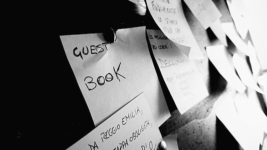 white printing papers posted on wall thumbnail
