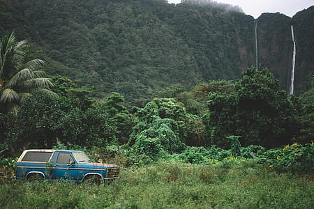 blue Ford Bronco SUV near waterfalls at daytime thumbnail