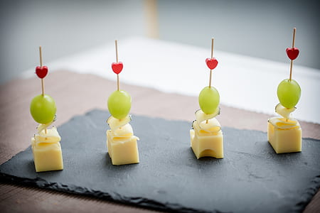 four cheese slices with green grapes on sticks thumbnail