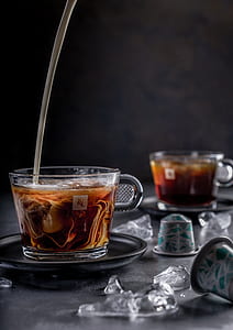 clear glass teacup filled with tea thumbnail