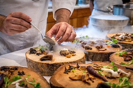 Chef Preparing Vegetable Dish on Tree Slab thumbnail