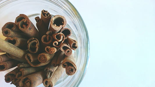 brown cinnamon barks on clear glass jar thumbnail