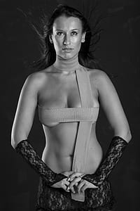 grayscale photo of covering her body with strap with lace hand warmer thumbnail