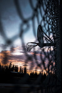 silhouette photography of black basketball hoop thumbnail