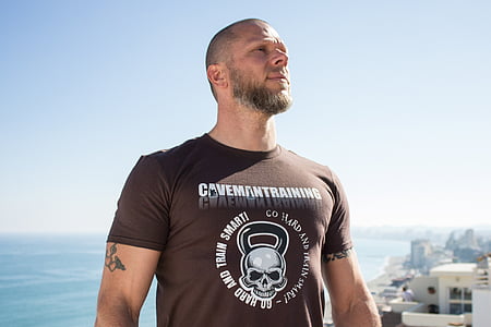 man wearing brown crew-neck shirt thumbnail