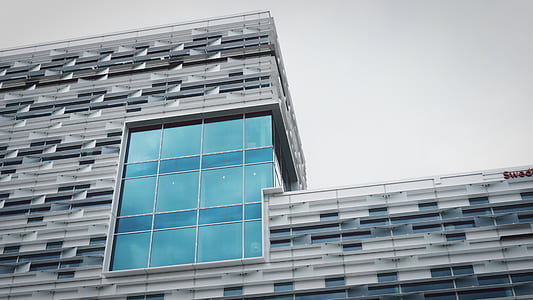 curtain wall building under white sky at daytime thumbnail