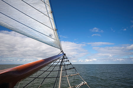 sail boat under blue sky thumbnail
