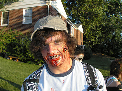 man in white shirt have a wound on his face costume during daytime thumbnail