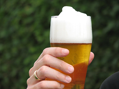 person holding cup of beer at daytime thumbnail