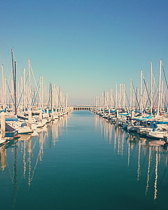 landscape photography of inline sailboats thumbnail