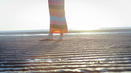 woman standing on shoreline thumbnail