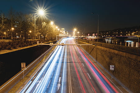 Car lights on the night highway in the city thumbnail