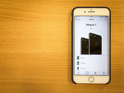 silver iPhone 6 with black case turned on showing jet black iPhone 7 thumbnail