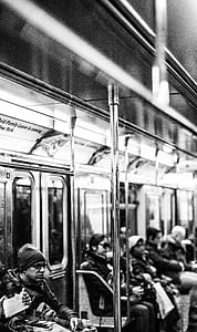 grayscale photography of people inside train thumbnail