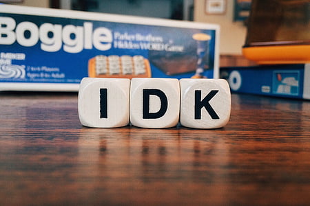 closeup photography of IDK boggle letter dices on table thumbnail