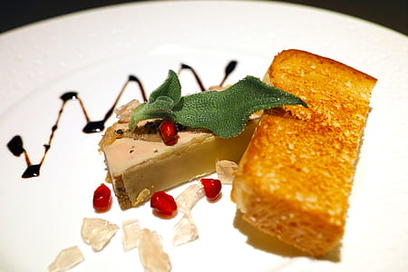 slice bread beside leaf on plate thumbnail