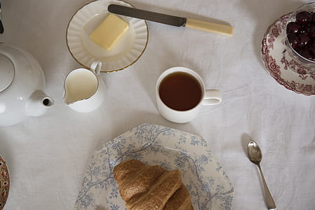 white ceramic mug beside white ceramic plate thumbnail