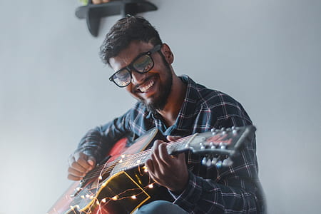 man playing acoustic guitar thumbnail