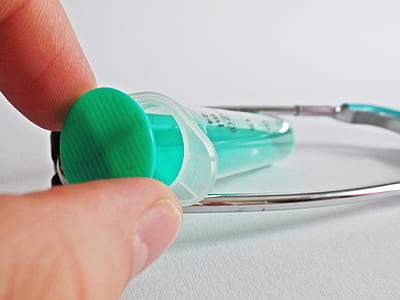 person holding syringe thumbnail