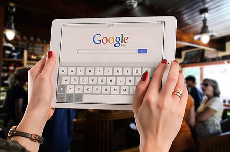 person using iPad searing in google search engine thumbnail