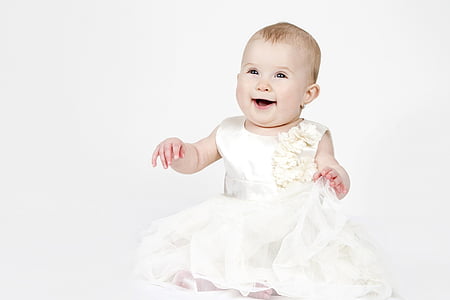 baby wearing white crew-neck sleeveless mini dress thumbnail