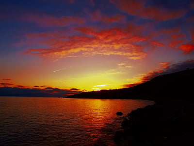 silhouette photo of mountain with background of sunset thumbnail