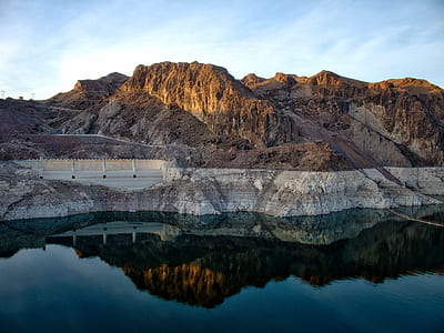 dam near body of water and mountain at daytime thumbnail