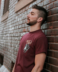 man wearing red crew-neck shirt thumbnail