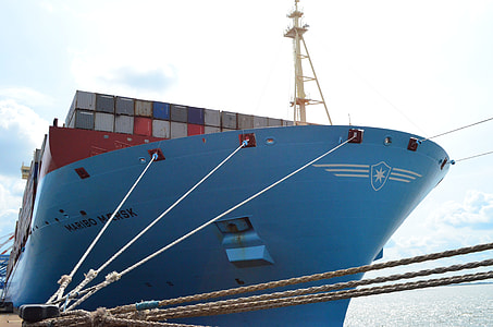 blue shipping container ship near docking area during daytime thumbnail