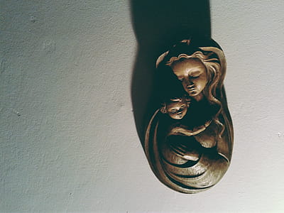 Woman Hugging Her Kid Bust Figurine thumbnail