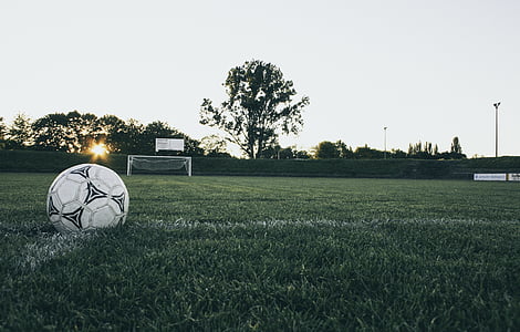 white soccer ball on grass field thumbnail