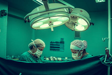 Two Person Doing Surgery Inside Room thumbnail