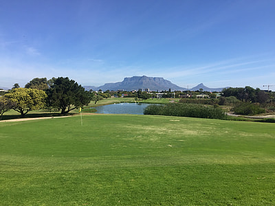 green grass field beside lake thumbnail