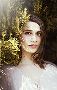woman beside green leafed plant taking selfie thumbnail