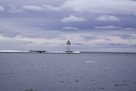 Lighthouse under the cloudy skies in Grand Marais, Minnesota thumbnail