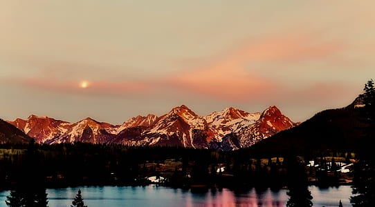 snow-covered mountain near body of water wallpaper thumbnail