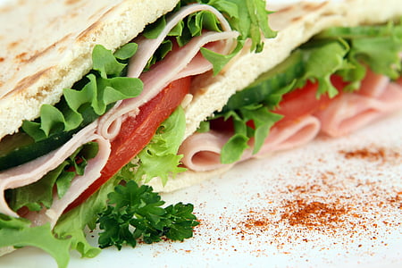sandwich with lettuce, sliced tomatoes, and cold cuts thumbnail