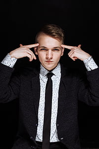 closeup photo of man wearing suit jacket thumbnail