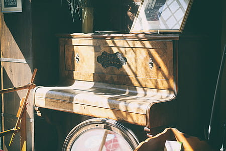 brown wooden upright piano thumbnail